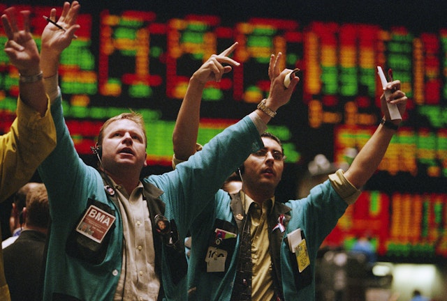 Traders waving arms on Exchange floor