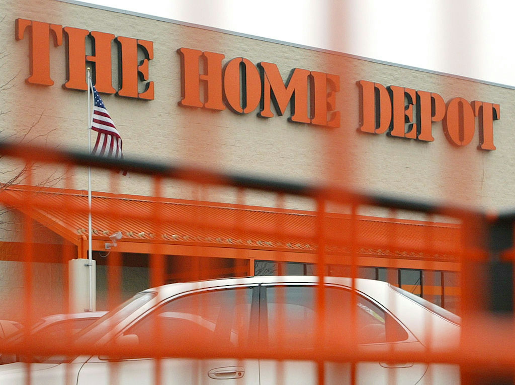 MOUNT PROSPECT, IL - FEBRUARY 19: A Home Depot sign is seen through one of its orange shopping carts February 19, 2004 in Mount Prospect, Illinois. Home Depot, the world's largest home improvement retailer, will announce its 4th Quarter and Fiscal Year 2003 Earnings February 24, 2004. (Photo by Tim Boyle/Getty Images)