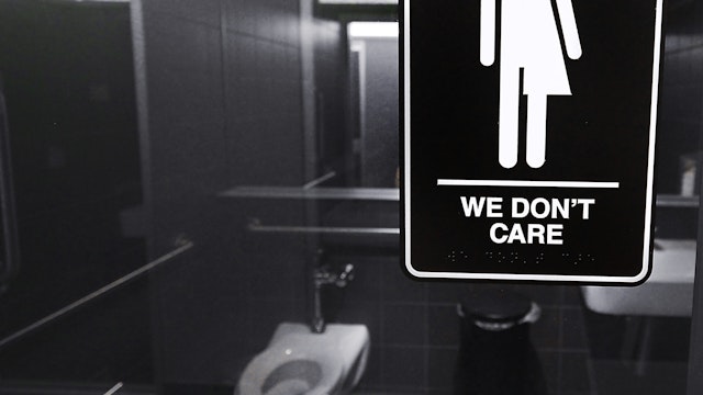 Gender neutral signs are posted in the 21C Museum Hotel public restrooms on May 10, 2016 in Durham, North Carolina.