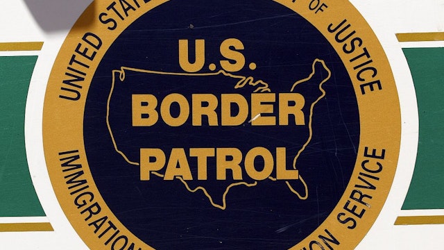 NOGALES, AZ - MAY 14: The U.S. Border Patrol emblem is seen on the side of an agent's truck patrolling the border May 14, 2006 in Nogales, Arizona. U.S. President George W. Bush will address the nation on the immigration issue May 15. (Photo by Jeff Topping/Getty Images)