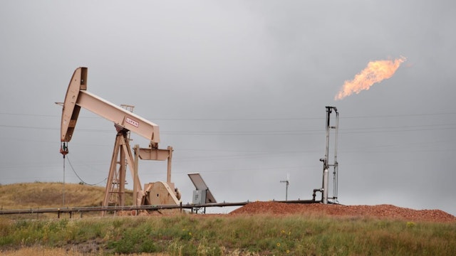 Pump jacks and a gas flare are seen near Williston, North Dakota, on September 6, 2016. Only a few years ago workers from across the US flooded into this once booming oil town with the expectation of easily finding well-paid work, but those days are gone in Williston - the epicenter of the US oil boom (and subsequent bust) and a town of 27,000 people that's doubled in size in the last six years.