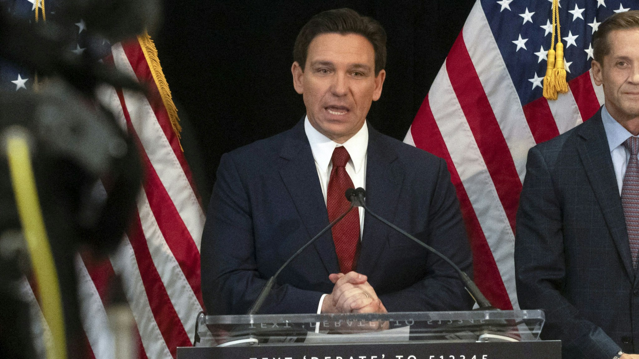 Florida Governor and Republican presidential hopeful Ron DeSantis speaks in the spin room following a debate held by Fox News, in Alpharetta, Georgia, on November 30, 2023. The leaders of two of the largest US states went head-to-head November 30 in a prime-time debate offering contrasting views of how the deeply-polarized nation should be run -- and a preview of how the 2028 White House race might look. Republican Florida governor Ron DeSantis and Gavin Newsom, his counterpart in Democratic California, have been hammering each other for years over their vastly differing outlooks but the at times bad-tempered debate marked their first in-person clash.