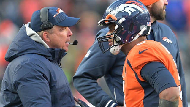 Denver Broncos Head coach Sean Payton, left, and Denver Broncos quarterback Russell Wilson (3) talks during the second half at Empower Field at Mile High on October 29, 2023 in Denver, Colorado. The Denver Broncos beat the Kansas City Chiefs 24 to 9 during week 8 of the NFL regular season.