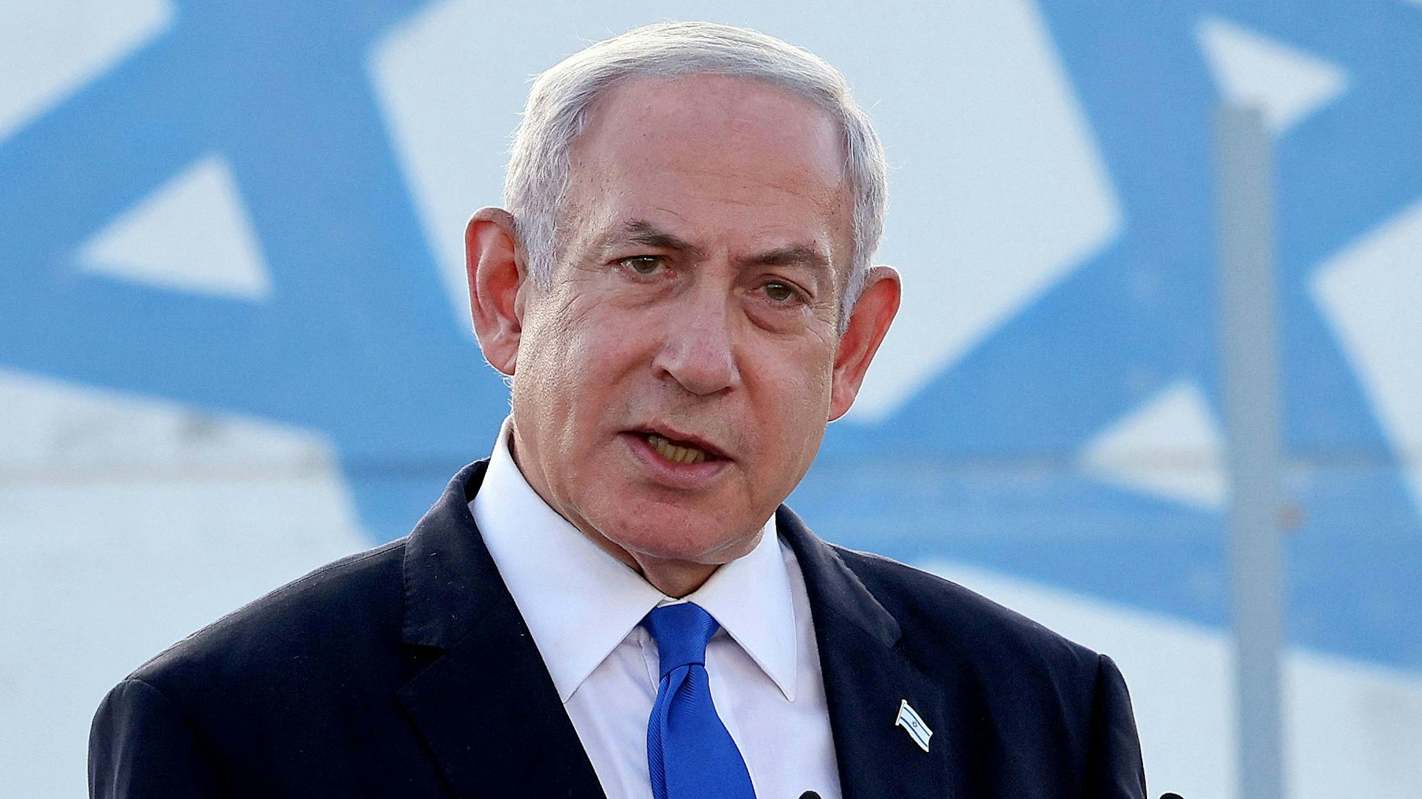 TOPSHOT - Israel's Prime Minister Benjamin Netanyahu delivers a speech during his visit to an Israeli unmanned aerial vehicle (UAV) centre, at the Palmachim Airbase near the city of Rishon LeZion on July 5, 2023.