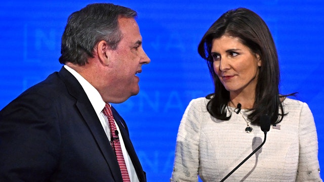 Former Governor of New Jersey Chris Christie (L) and former Governor from South Carolina and UN ambassador Nikki Haley speak during a break in the fourth Republican presidential primary debate at the University of Alabama in Tuscaloosa, Alabama, on December 6, 2023.