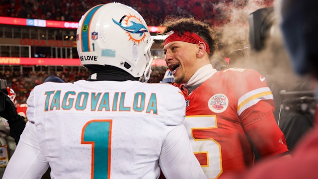 Patrick Mahomes #15 of the Kansas City Chiefs interacts with Tua Tagovailoa #1 of the Miami Dolphins after an NFL Super Wild Card Weekend playoff game at GEHA Field at Arrowhead Stadium on January 13, 2024 in Kansas City, Missouri.