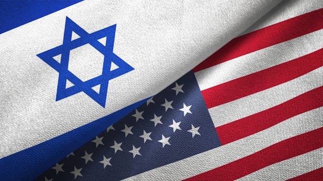 Oleksii Liskonih. Getty Images. United States and Israel flag together realtions textile cloth fabric texture