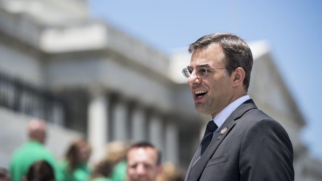 Rep. Justin Amash, R-Mich., speaks to a school group on the House steps at the Capitol on Wednesday, June 12, 2019.