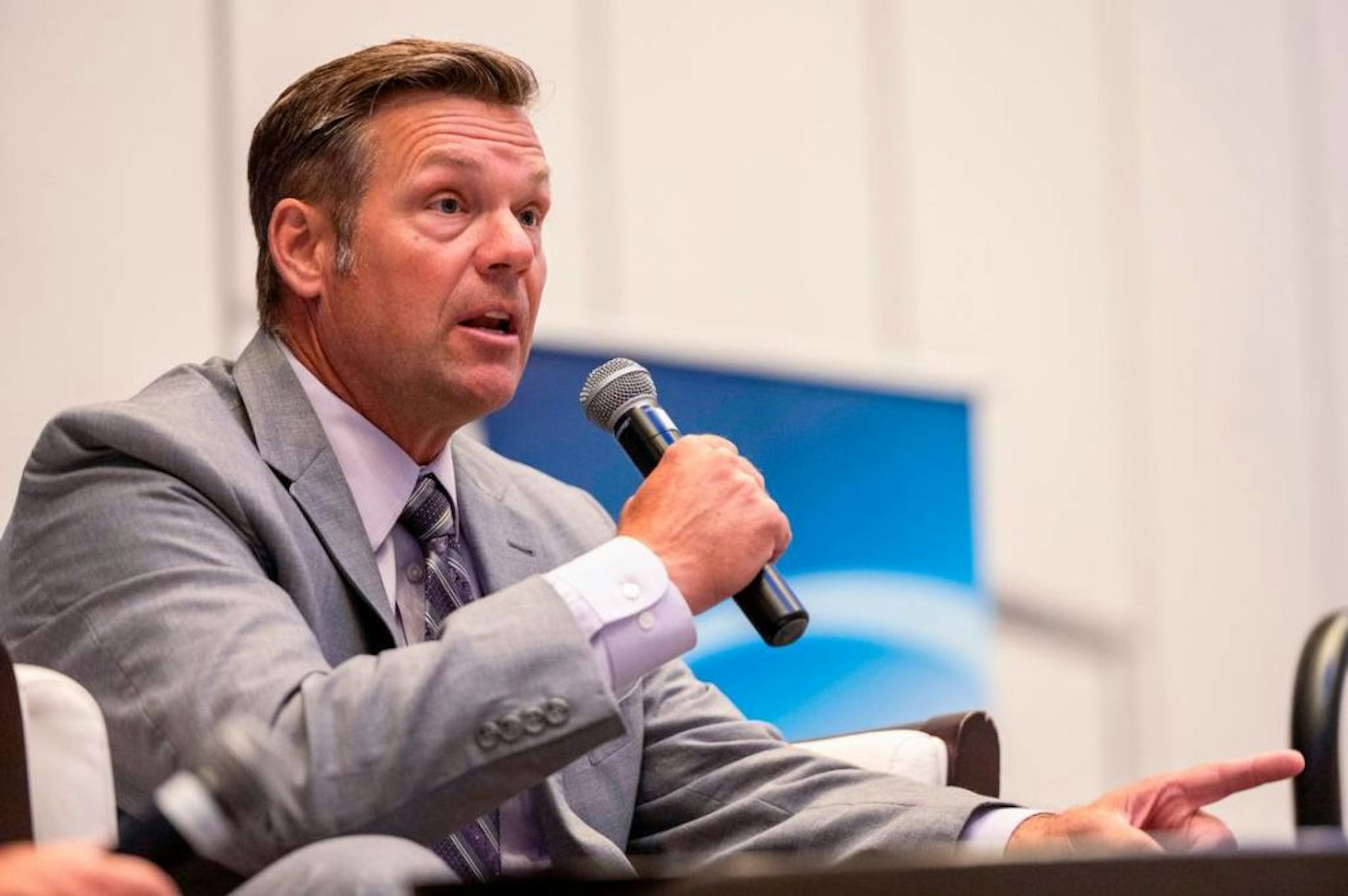 Former Kansas Secretary of State Kris Kobach answers questions from a moderator during a Kansas Chamber of Commerce event at the Embassy Suites by Hilton on Wednesday, Sep. 7, 2022, in Olathe.