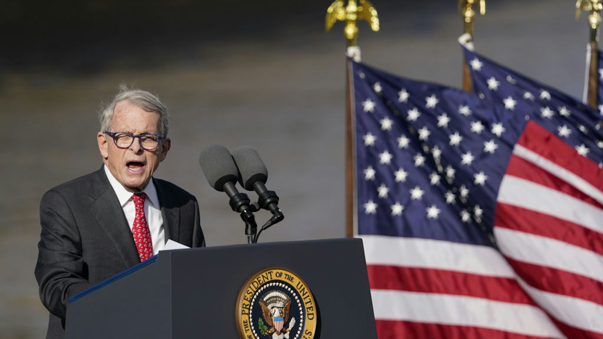 Mike DeWine, governor of Ohio, speaks during an event in Covington, Kentucky, US, on Wednesday, Jan. 4, 2023. President Biden spoke about the 2021 Bipartisan Infrastructure Law and the bills $1.6 billion used for repairs to the 60-year-old Brent Spence Bridge, which connects a span of Interstate 75 over the Ohio River into Cincinnati. Photographer: Joshua A. Bickel/Bloomberg via Getty Images