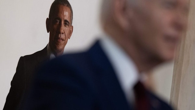 A portrait of former US President Barack Obama is seen as US President Joe Biden speaks during an event in the at the Grand Staircase of the White House to mark the one year anniversary of the Uvalde school mass shooting May 24, 2023, in Washington, DC.