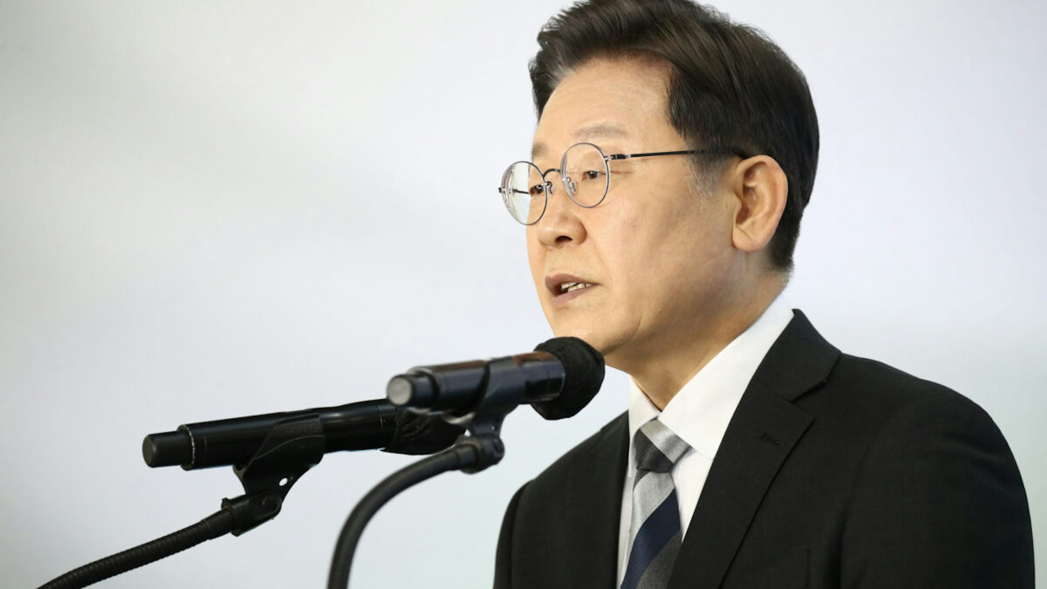 GYEONGGI-DO, SOUTH KOREA - JANUARY 04: Lee Jae-myung, presidential candidate of the ruling Democratic Party, speaks during a news conference at the KIA Motors plant on January 04, 2022 in Gyeonggi-Do, South Korea. Lee has ranked top in all polling results this year, as South Korea has just over 64 days left until the March election.