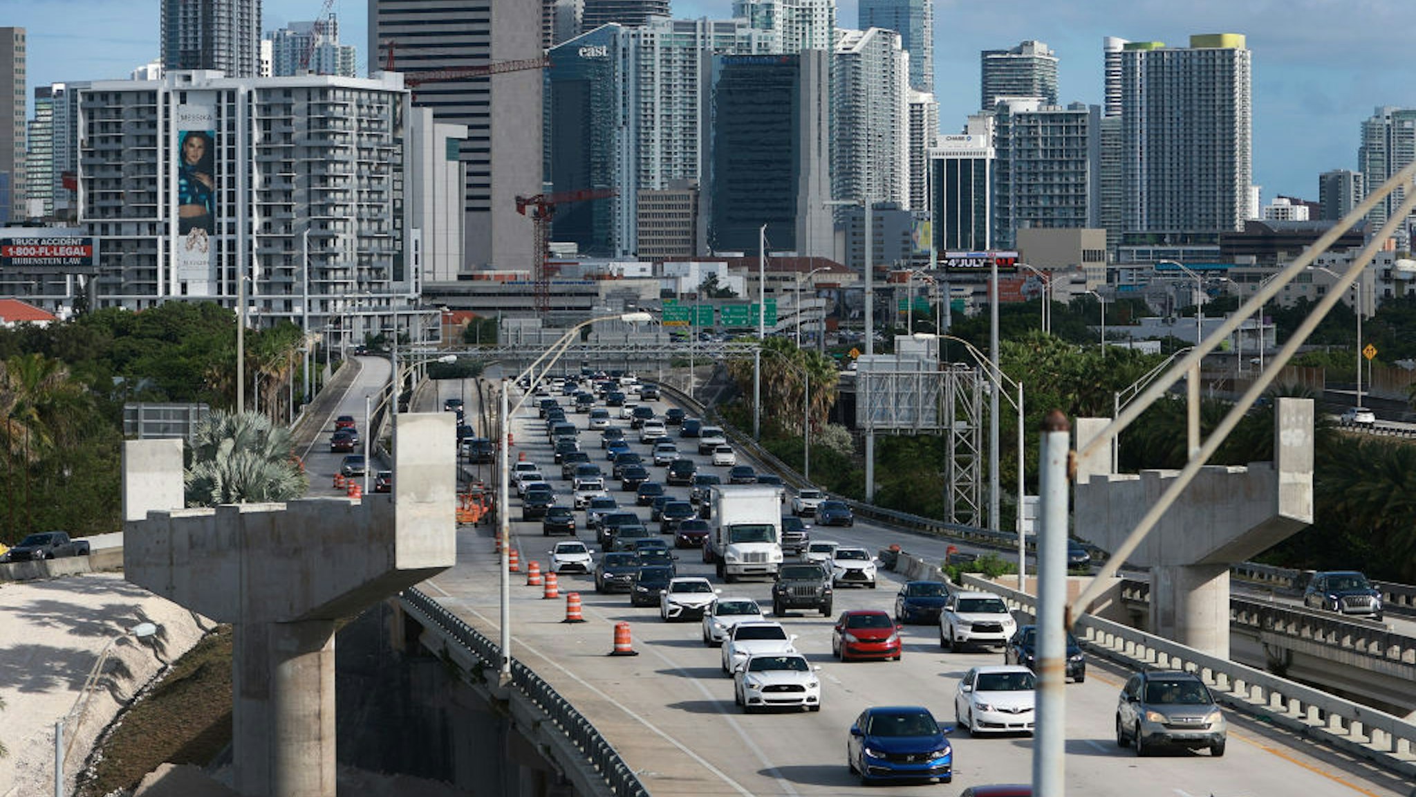 MIAMI, FLORIDA - JUNE 30: Vehicles drive along I-95 as they leave the downtown area on June 30, 2022 in Miami, Florida. According to a report from AAA for the July 4 holiday weekend, they forecast that 42 million Americans, the most ever, will take a road trip of 50 miles or more. (Photo by Joe Raedle/Getty Images)