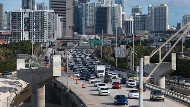 MIAMI, FLORIDA - JUNE 30: Vehicles drive along I-95 as they leave the downtown area on June 30, 2022 in Miami, Florida. According to a report from AAA for the July 4 holiday weekend, they forecast that 42 million Americans, the most ever, will take a road trip of 50 miles or more. (Photo by Joe Raedle/Getty Images)