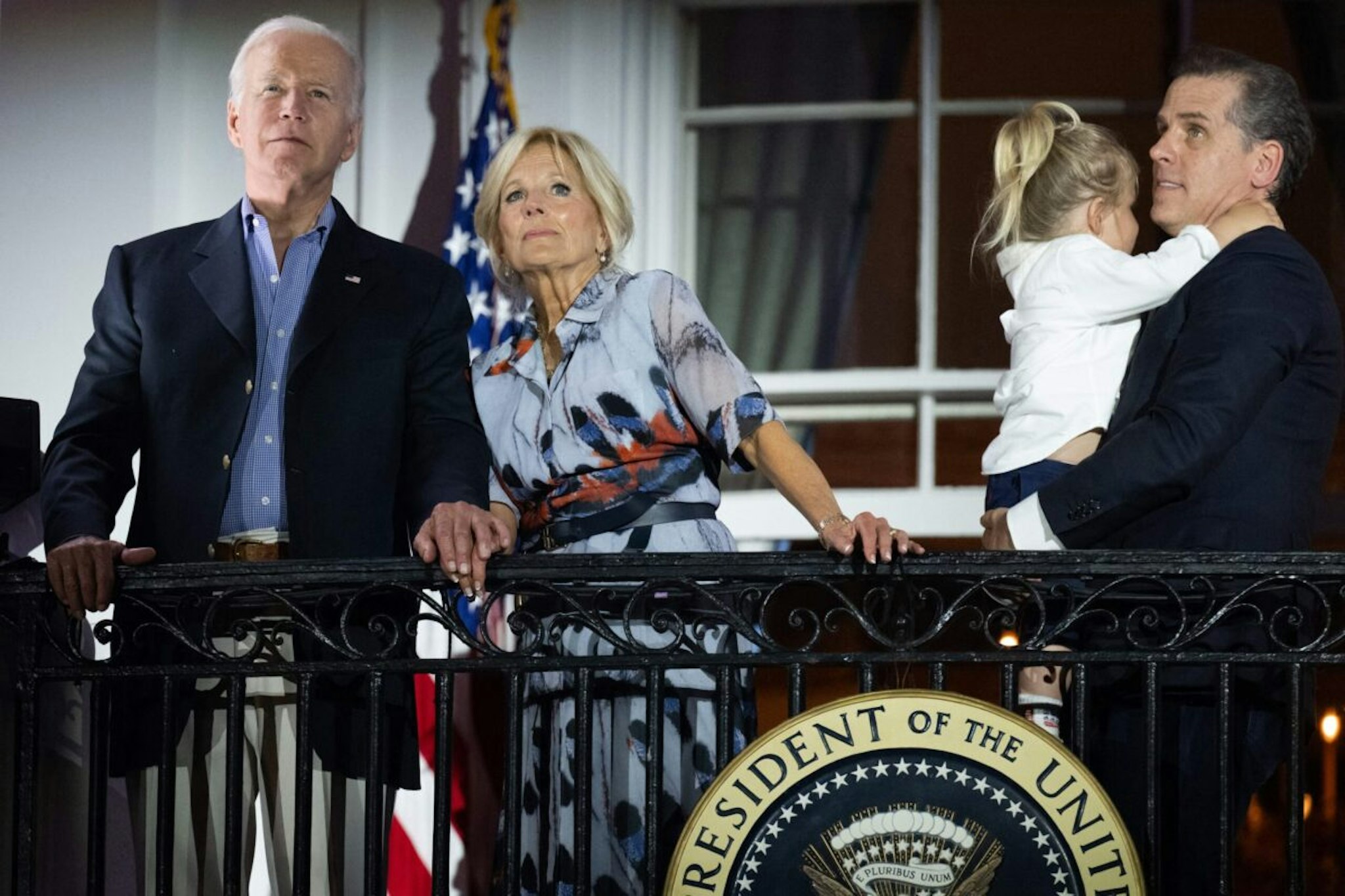 US President Joe Biden, First Lady Jill Biden and Hunter Biden (R) watch the Independence Day fireworks display from the Truman Balcony of the White House in Washington, DC, on July 4, 2023.