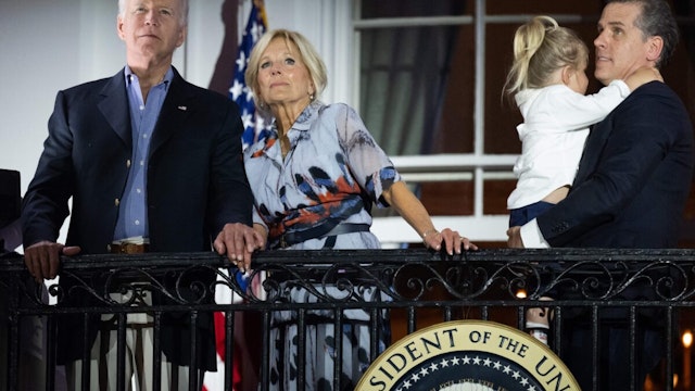 US President Joe Biden, First Lady Jill Biden and Hunter Biden (R) watch the Independence Day fireworks display from the Truman Balcony of the White House in Washington, DC, on July 4, 2023.