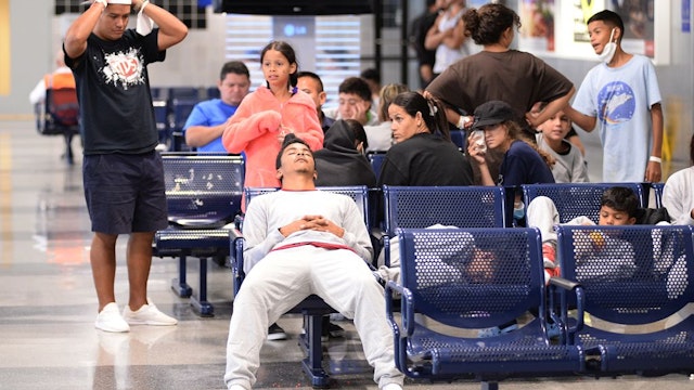 CHICAGO, ILLINOIS, UNITED STATES - SEPTEMBER 20: Hundreds of asylum seekers temporarily stay at the O'Hare International Airport in Chicago, Illinois, United States on September 20, 2023. Chicago has reportedly signed a $29 million contract to build a tent city for the migrants, while the Virginia-based GardaWorld Federal Services hired to build at least six temporary shelter camps for the asylum seekers at the Chicago area. (Photo by Jacek Boczarski/Anadolu via Getty Images)