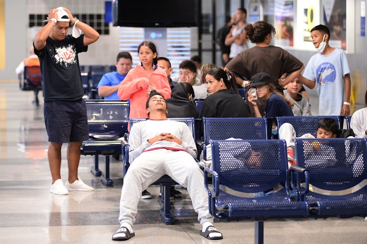 NextImg:Migrants Now Sleeping At Airports In Two Major U.S. Cities