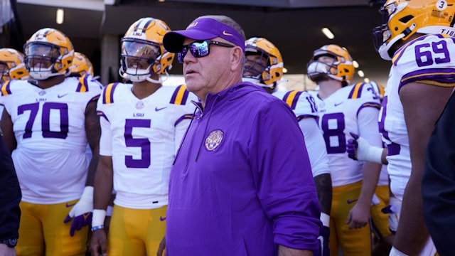 COLUMBIA, MISSOURI - OCTOBER 07: Head coach Brian Kelly of the LSU Tigers stands with his team as they waits to take to the field prior to a game against the Missouri Tigers at Faurot Field/Memorial Stadium on October 07, 2023 in Columbia, Missouri. (Photo by Ed Zurga/Getty Images)