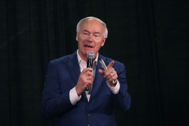 IOWA CITY, IOWA - OCTOBER 20: Republican presidential candidate former Arkansas Governor Asa Hutchinson speaks to guests at the third annual MMM Tailgate celebration hosted by U.S. Rep. Mariannette Miller-Meeks (R-IA) on October 20, 2023 in Iowa City, Iowa. This year's event attracted several of Republican presidential candidates.