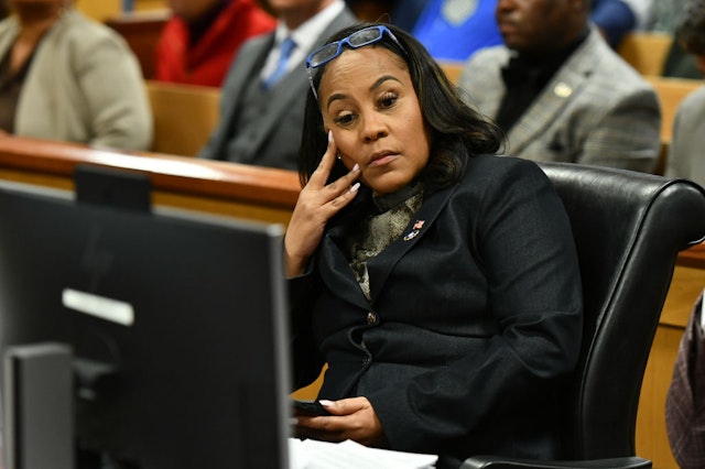 ulton County District Attorney Fani Willis appears before Judge Scott McAfee for a hearing in the 2020 Georgia election interference case at the Fulton County Courthouse on November 21, 2023 in Atlanta, Georgia.