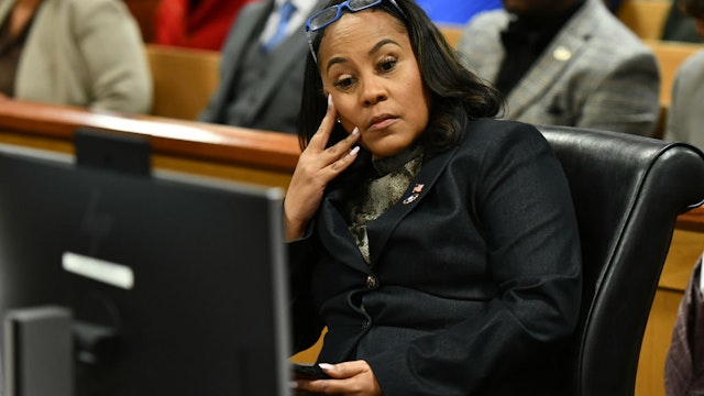ulton County District Attorney Fani Willis appears before Judge Scott McAfee for a hearing in the 2020 Georgia election interference case at the Fulton County Courthouse on November 21, 2023 in Atlanta, Georgia.