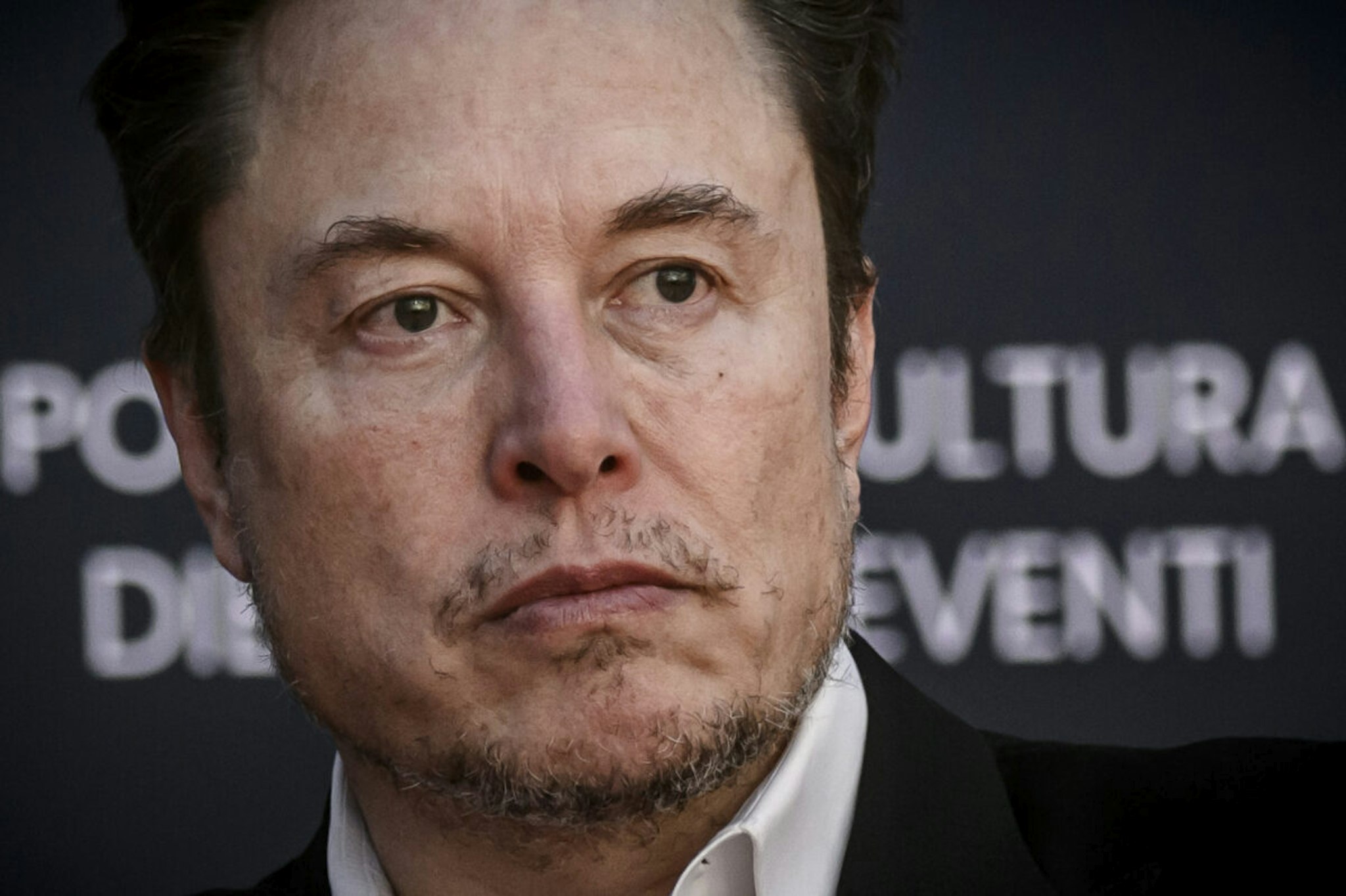 ROME, ITALY - DECEMBER 15: Elon Musk, chief executive officer of Tesla Inc and X (formerly Twitter) Ceo speaks at the Atreju political convention organized by militants of Fratelli d'Italia (Brothers of Italy), on December 15, 2023 in Rome, Italy. Italian Prime Minister Giorgia Meloni's right-wing political party organised a four-day political festival in the Italian capital.