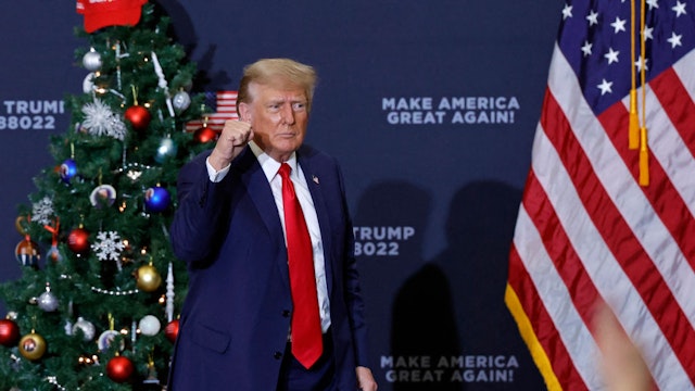 Former US President and 2024 presidential hopeful Donald Trump gestures at the end of a campaign event in Waterloo, Iowa, on December 19, 2023. An appeals court in Colorado on December 19, 2023 ruled Donald Trump cannot appear on the state's presidential primary ballot because of his involvement in the attack on the Capitol in January 2021. (Photo by KAMIL KRZACZYNSKI / AFP)