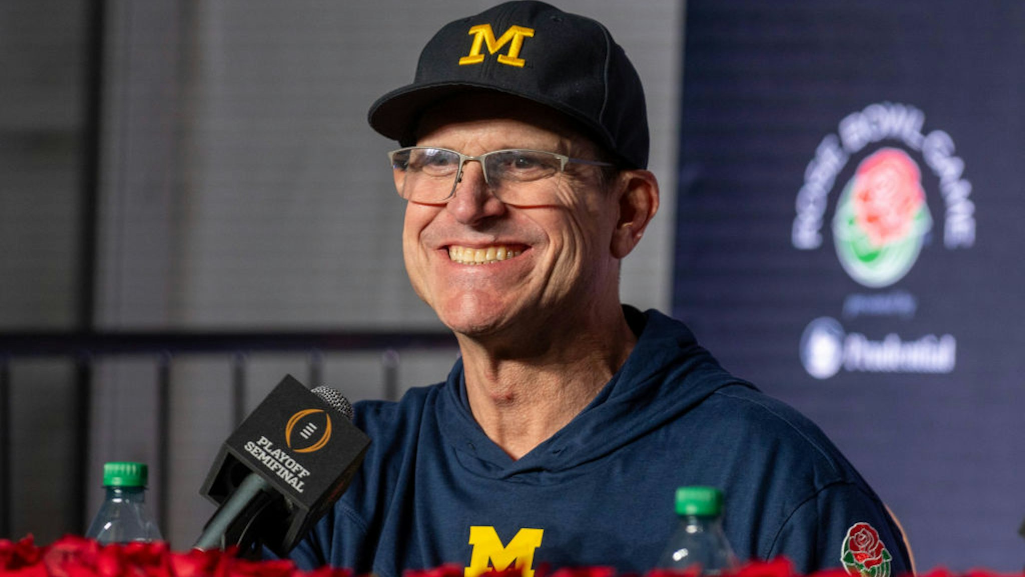 PASADENA, CALIFORNIA - JANUARY 01: Head Coach Jim Harbaugh of the Michigan Wolverines speaks to media during the post game press conference after the CFP Semifinal Rose Bowl Game against the Alabama Crimson Tide at Rose Bowl Stadium on January 01, 2024 in Pasadena, California. The Michigan Wolverines won the game 27-20 in overtime. (Photo by Aaron J. Thornton/Getty Images)