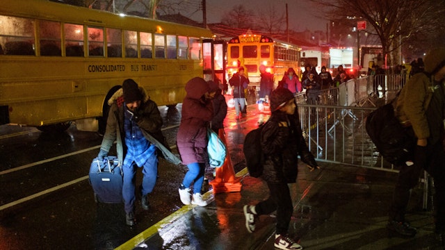 UNITED STATES -January 9: Migrants evacuated from Floyd Bennett Field arrive at James Madison High School on Bedford Avenue in Brooklyn, New York City during a storm on Tuesday, January 9, 2024.
