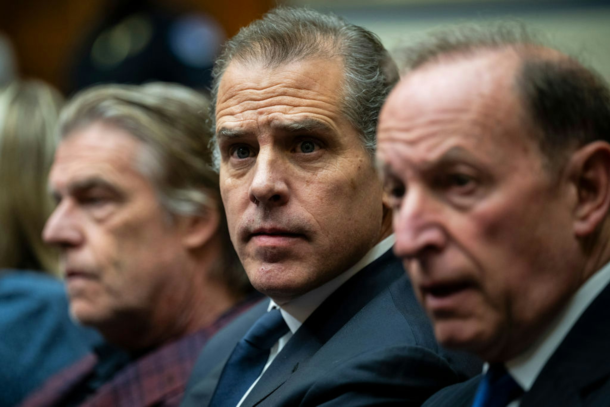 Hunter Biden, son of US President Joe Biden, center, with attorneys Kevin Morris, left, and Abbe Lowell, right, during a House Oversight Committee markup on Capitol Hill in Washington, DC, US, on Wednesday, Jan. 10, 2024. The House Judiciary and Oversight committees are expected to recommend that the president's son be held in criminal contempt of Congress for refusing to comply with a subpoena in the ongoing impeachment inquiry into his father, President Joe Biden. Photographer: Graeme Sloan/Bloomberg via Getty Images