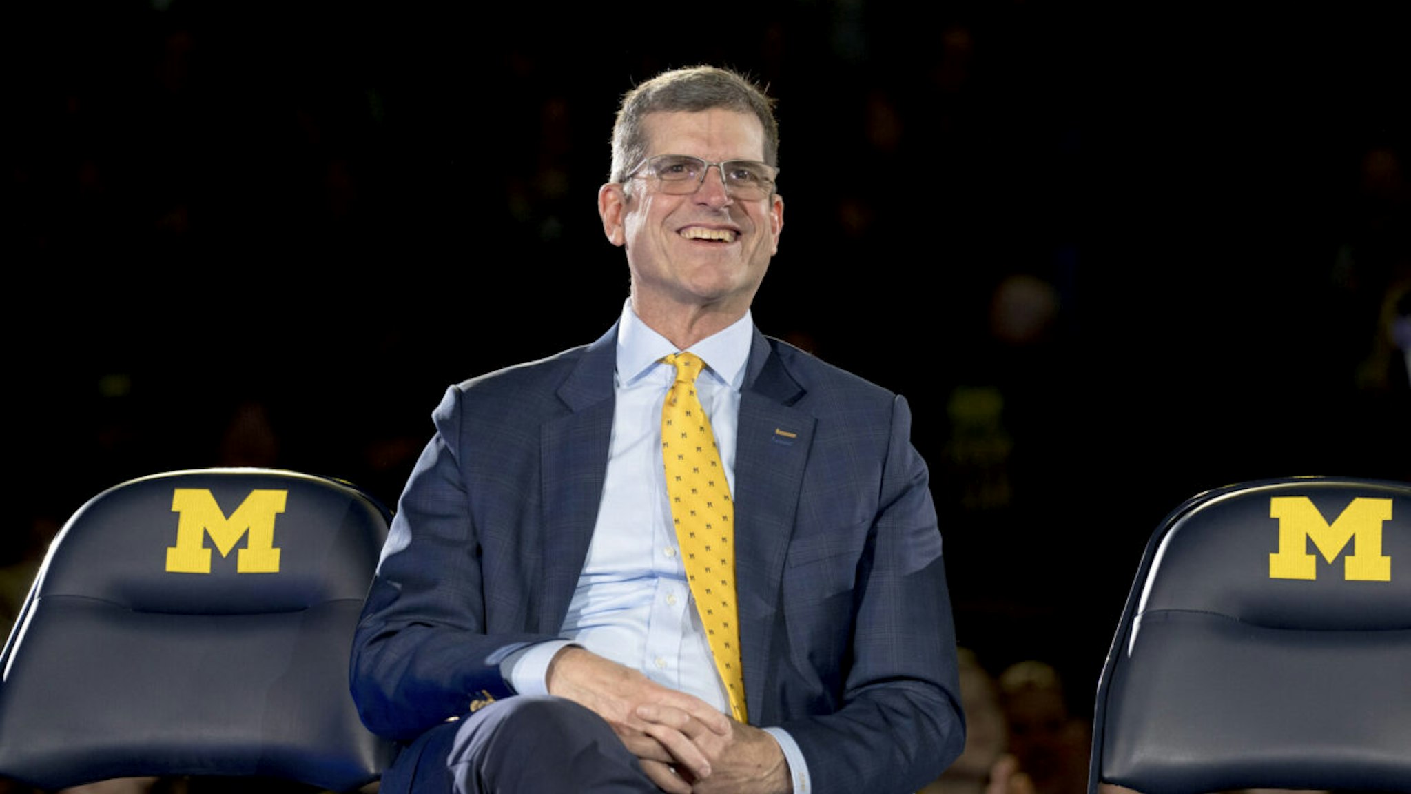 ANN ARBOR, MICHIGAN - JANUARY 13: Head coach Jim Harbaugh of the Michigan Wolverines smiles during the Michigan Wolverines football National Championship celebration on January 13, 2024 at Crisler Center in Ann Arbor, Michigan.