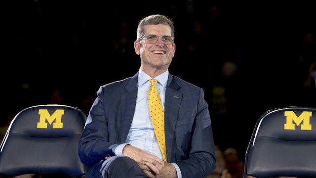 ANN ARBOR, MICHIGAN - JANUARY 13: Head coach Jim Harbaugh of the Michigan Wolverines smiles during the Michigan Wolverines football National Championship celebration on January 13, 2024 at Crisler Center in Ann Arbor, Michigan.