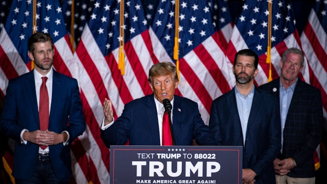 Former US President Donald Trump, second left, speaks at a caucus night watch party in Des Moines, Iowa, US, on Monday, Jan. 15, 2024. Trump cruised to victory in the Iowa caucus, warding off a late challenge from rivals Ron DeSantis and Nikki Haley and cementing his status as the clear Republican frontrunner in the race. Photographer: Al Drago/Bloomberg via Getty Images