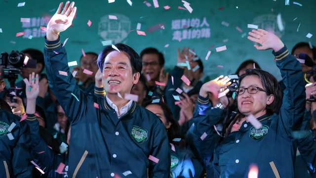 TAIPEI, TAIWAN - JANUARY 13: Confetti flies over the stage and crowd as Taiwan's Vice President and presidential-elect from the Democratic Progressive Party (DPP) Lai Ching-te (L) and his running mate Hsiao Bi-khim speak to supporters at a rally at the party's headquarters on January 13, 2024 in Taipei, Taiwan. Taiwan voted in a general election on Jan. 13 that will have direct implications for cross-strait relations. (Photo by Annabelle Chih/Getty Images)