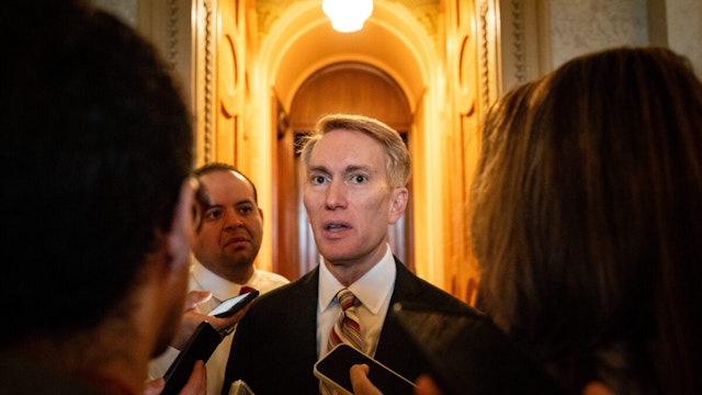 Senator James Lankford, a Republican from Oklahoma, center, speaks with members of the media outside the Senate Chamber at the US Capitol in Washington, DC, US, on Thursday, Jan. 25, 2024.