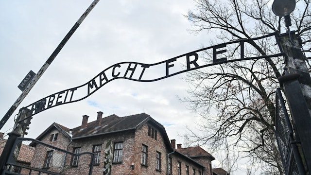 OSWIECIM, POLAND - JANUARY 23: The iconic entrance gate of the former Auschwitz concentration camp that reads 'Arbeit Macht Frei' (Work Sets You Free) is pictured on January 23, 2024 in Oswiecim, Poland. Among the attendees were participants in a symposium on anti-semitism organized by the European Jewish Association. (Photo by Omar Marques/Getty Images)