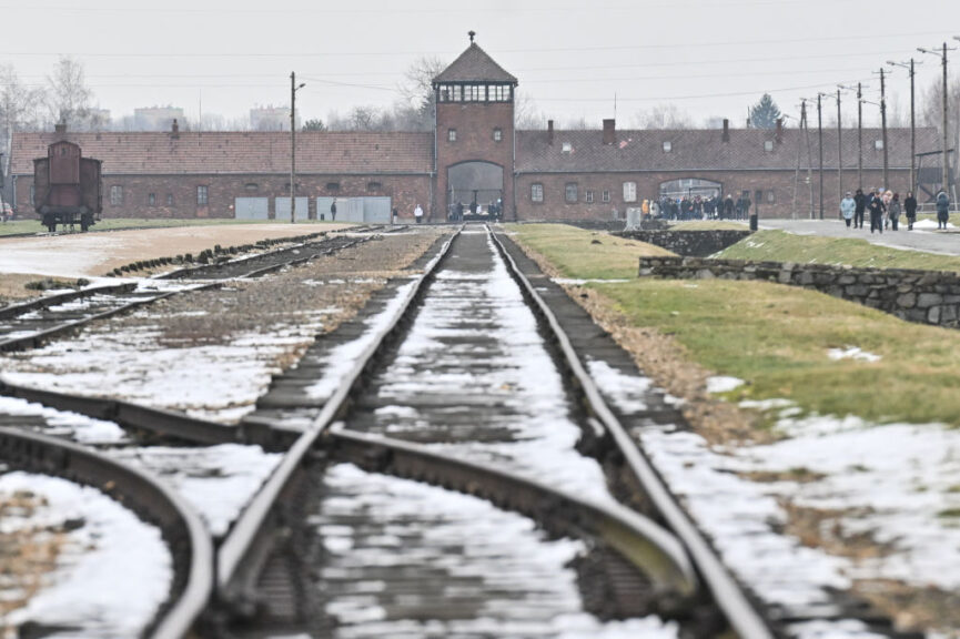 OSWIECIM, POLAND - JANUARY 23: A view of the entrance gate at the former Nazi death camp Auschwitz Birkenau on January 23, 2024 in Oswiecim, Poland. Among the attendees were participants in a symposium on anti-semitism organized by the European Jewish Association. (Photo by Omar Marques/Getty Images)