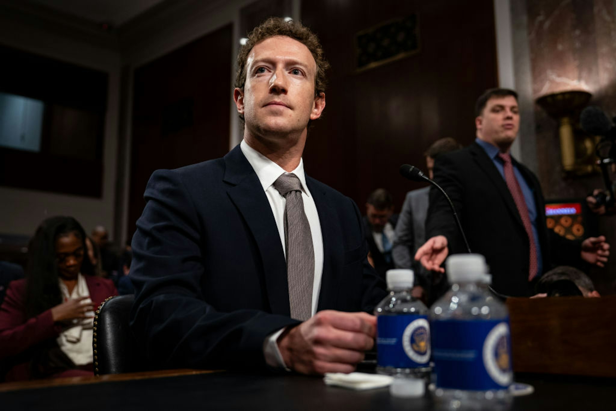 Mark Zuckerberg, chief executive officer of Meta Platforms Inc., center, arrives following a break during a Senate Judiciary Committee hearing in Washington, DC, US, on Wednesday, Jan. 31, 2024. Congress has increasingly scrutinized social media platforms as growing evidence suggests that excessive use and the proliferation of harmful content may be damaging young people's mental health. Photographer: Kent Nishimura/Bloomberg via Getty Images
