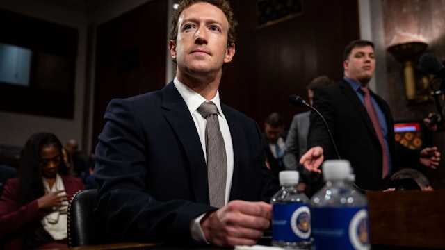 Mark Zuckerberg, chief executive officer of Meta Platforms Inc., center, arrives following a break during a Senate Judiciary Committee hearing in Washington, DC, US, on Wednesday, Jan. 31, 2024. Congress has increasingly scrutinized social media platforms as growing evidence suggests that excessive use and the proliferation of harmful content may be damaging young people's mental health. Photographer: Kent Nishimura/Bloomberg via Getty Images