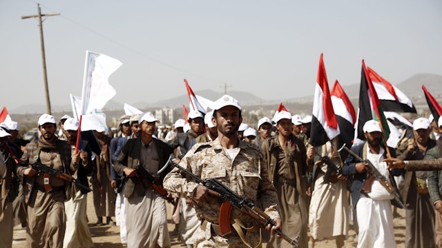 SANA'A, YEMEN - FEBRUARY 4: Houthi fighters participate in a rally in support of Palestinians in the Gaza Strip, and the recent Houthi strikes on shipping in the Red Sea and Gulf of Aden on February 4, 2024, on the outskirts of Sana'a, Yemen. The rally comes amid U.S. and British strikes against 36 Houthi targets in Yemen on Saturday, the second day of major U.S. attacks following an attack on American troops last weekend that killed three U.S. soldiers at a remote post in Jordan just across the border with Iraq by fighters with links to Iran.