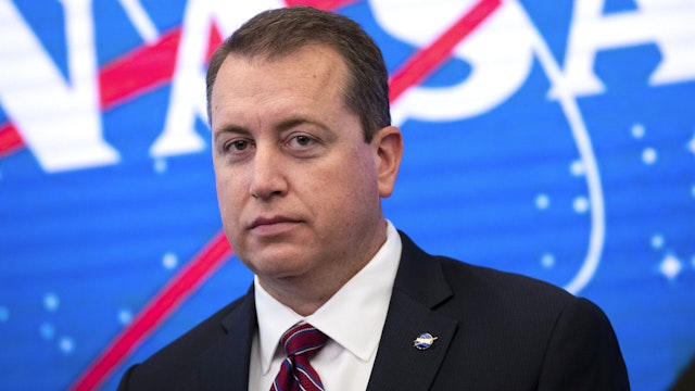 NEW YORK, NY - JUNE 7: NASA Chief Financial Officer Jeff DeWit looks on during a press conference to address the opening of the International Space Station to expanded commercial activities, at the Nasdaq MarketSite, June 7, 2019 in New York City. The efforts are intended to broaden the scope of commercial activity on the space station beyond the ISS National Lab, which is limited to research and development. The International Space Station originally launched into orbit in 1998 and has been continually inhabited since November 2000.