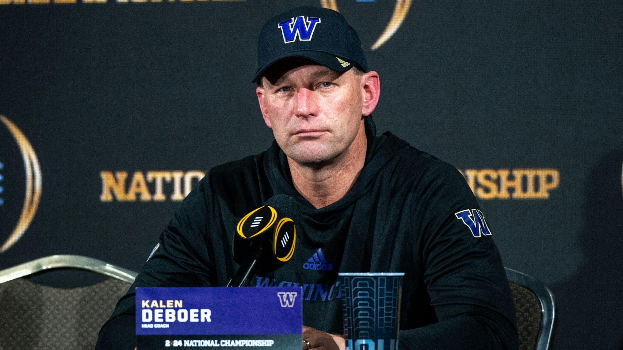 HOUSTON, TEXAS - JANUARY 08: Head Football Coach Kalen DeBoer of the Washington Huskies speaks to media during the post game press conference after the 2024 CFP National Championship game against the Michigan Wolverines at NRG Stadium on January 08, 2024 in Houston, Texas. The Michigan Wolverines won the game 34-13.