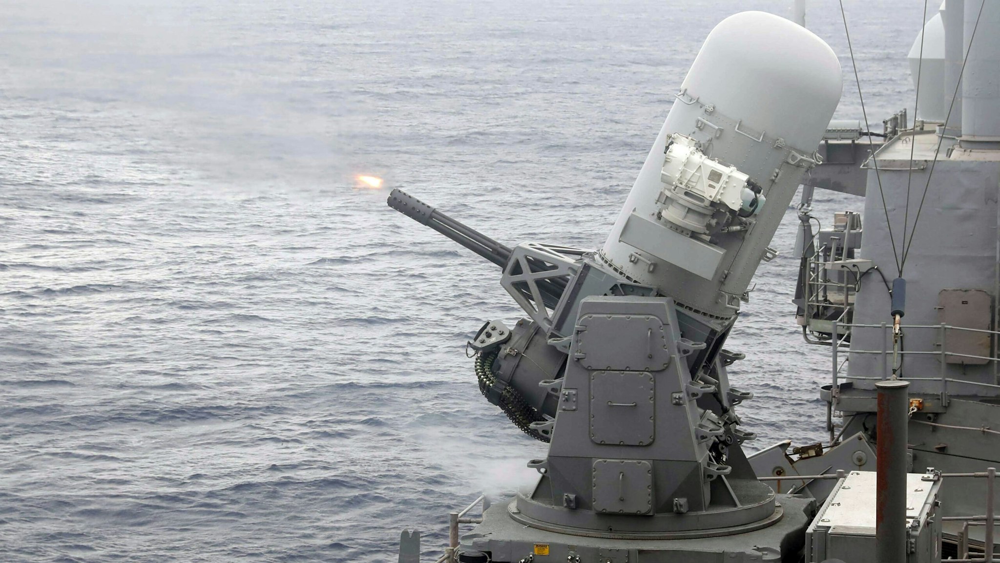 230115-N-BN445-1090 PHILIPPINE SEA (Jan. 15, 2023) The Ticonderoga-class guided-missile cruiser USS Chancellorsville (CG 62) fires its Phalanx close-in weapons system (CIWS) as a part of a live fire exercise while underway, Jan. 15 in the Philippine Sea. Chancellorsville is assigned to Commander, Task Force 70/Carrier Strike Group 5 underway preforming routine operations in support of a free and open Indo-Pacific.