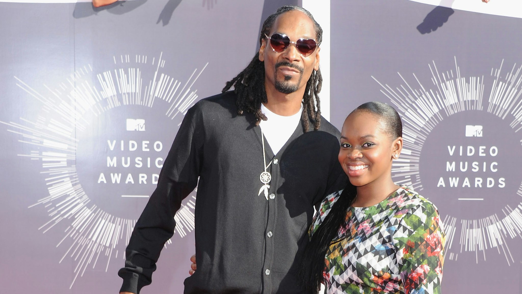 INGLEWOOD, CA - AUGUST 24: Rapper Snoop Dogg and Cori Broadus arrive at the 2014 MTV Video Music Awards at The Forum on August 24, 2014 in Inglewood, California.
