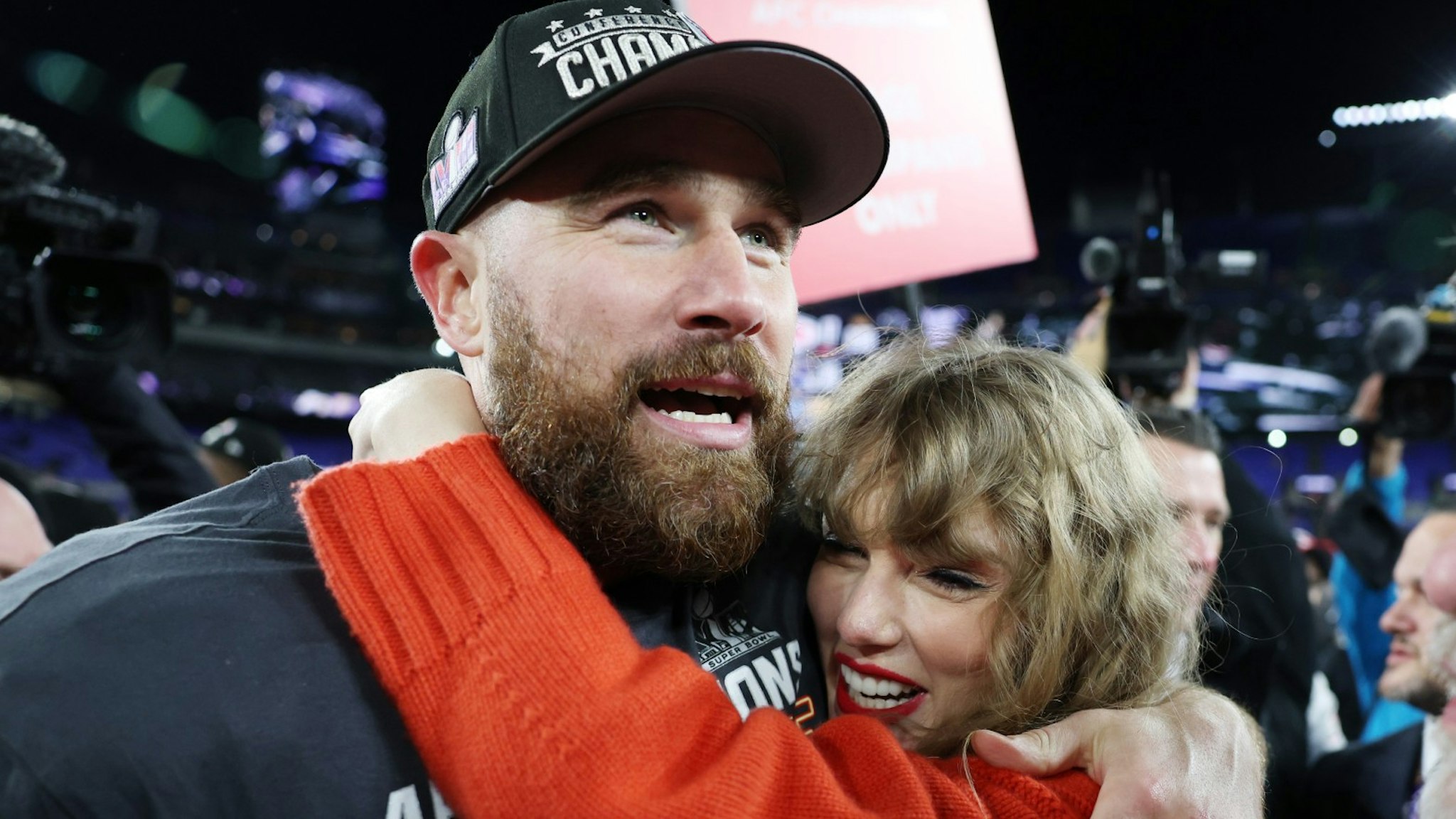 Travis Kelce #87 of the Kansas City Chiefs celebrates with Taylor Swift after a 17-10 victory against the Baltimore Ravens in the AFC Championship Game at M&T Bank Stadium on January 28, 2024 in Baltimore, Maryland.