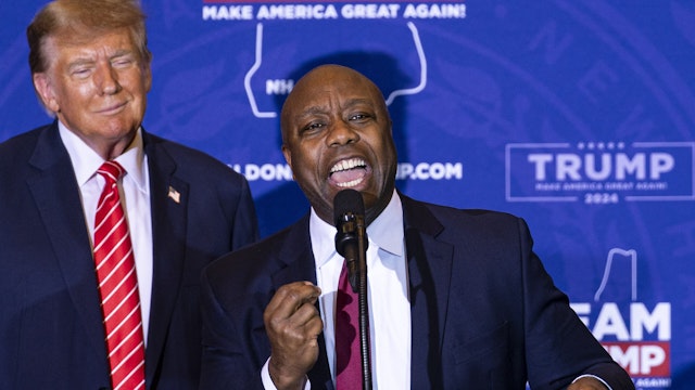 Senator Tim Scott, a Republican from South Carolina, right, speaks while standing next to former US President Donald Trump during a campaign event in Concord, New Hampshire, US, on Friday, Jan. 19, 2024. Fresh off his win in the Iowa caucuses this week, Trump took to Truth Social to insist that any deal on immigration and Ukraine aid contain every conservative demand for border and immigration changes, an aggressive position meant to force House GOP leaders into rejecting any Senate compromise.