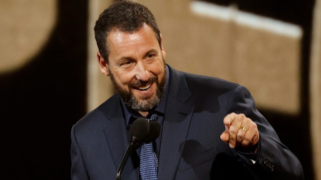 Adam Sandler accepts the People's Icon Award onstage during the 2024 People's Choice Awards held at Barker Hangar on February 18, 2024 in Santa Monica, California