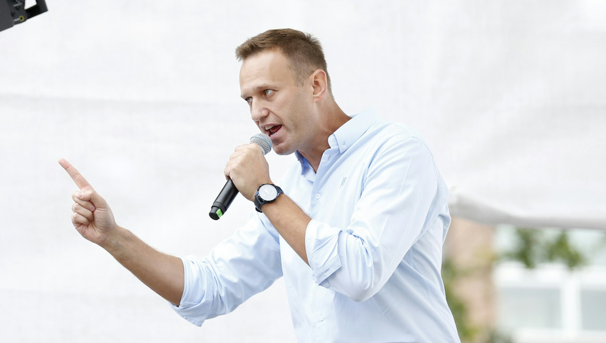Russian opposition leader Alexei Navalny addresses demonstrators during a rally to support opposition and independent candidates after authorities refused to register them for September elections to the Moscow City Duma, Moscow, July 20, 2019. (Photo by Maxim ZMEYEV / AFP via Getty Images)