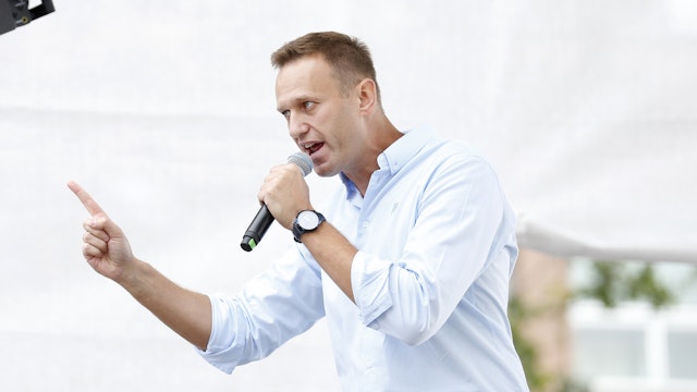 Russian opposition leader Alexei Navalny addresses demonstrators during a rally to support opposition and independent candidates after authorities refused to register them for September elections to the Moscow City Duma, Moscow, July 20, 2019. (Photo by Maxim ZMEYEV / AFP via Getty Images)